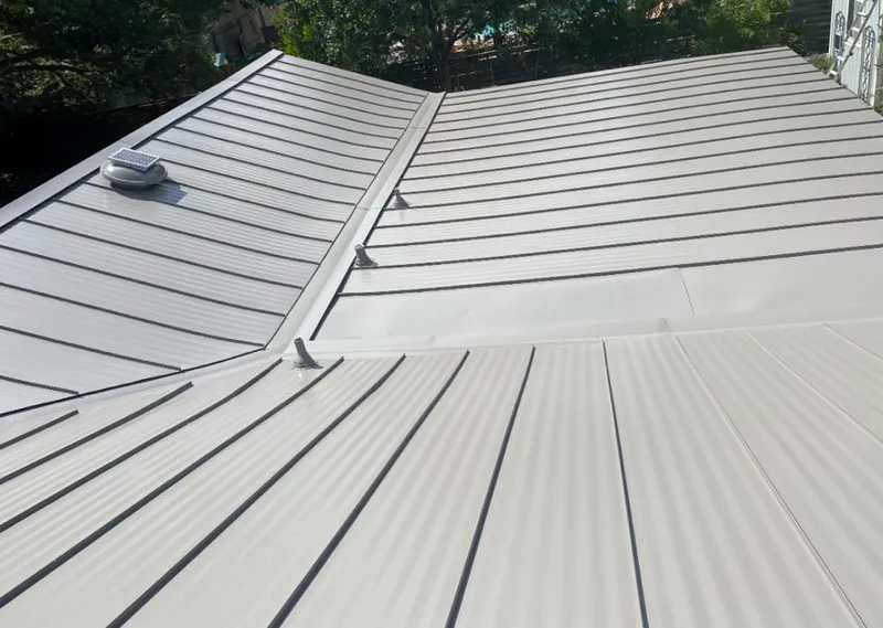 Solar attic fan installed on a metal roof for Roof Ventilation in Burlingame